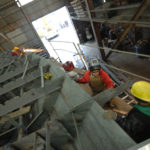 In R.I., mixed picture on stimulus impact STIMULATING EFFECTS: Blount Boats employees Brian Laquerre, middle, and John Aguiar, foreground, add supports to hold up the deck of a boat. The company was approved for ARRA funding but must come up with a 25 percent match of $289,000. /