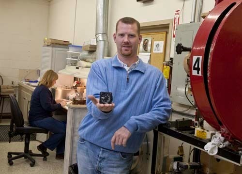 JET-SETTING: Matthew Kearney, vice president of Kearflex Engineering Co., holds up a vertical speed indicator his company makes for the military’s F/A-18 Hornet fighter jet. The company was founded in 1963. / JET-SETTING: Matthew Kearney, vice president of Kearflex Engineering Co., holds up a vertical speed indicator his company makes for the military’s F/A-18 Hornet fighter jet. The company was founded in 1963. /