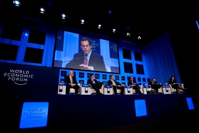 PROVIDENCE EQUITY PARTNERS CEO Jonathan M. Nelson, shown on screen, speaks Wednesday during a panel at the World Economic Forum in Switzerland. / PROVIDENCE EQUITY PARTNERS CEO Jonathan M. Nelson, shown on screen, speaks Wednesday during a panel at the World Economic Forum in Switzerland. /