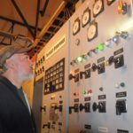 RUNNING ON WATER: Andy Therien, an electrical contractor with C&K Electrical, looks over the control panel at Pawtucket Hydro-power Inc. Estimates show hydroelectricity could power more than 3,000 homes in the Blackstone and Pawtuxet river watersheds. / 