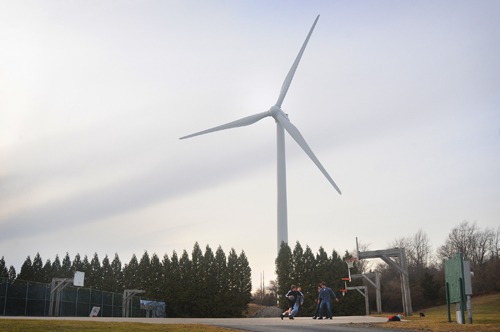 WINDFALL: Portsmouth has largely embraced wind turbines, supporting the development of them on town property and at Portsmouth Abbey School, shown above. / WINDFALL: Portsmouth has largely embraced wind turbines, supporting the development of them on town property and at Portsmouth Abbey School, shown above. /