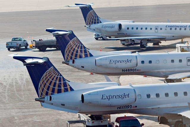 CONTINENTAL EXPRESS planes at Newark Liberty International Airport last year. The carrier plans to cut 18 jobs at T.F. Green in June. / CONTINENTAL EXPRESS planes at Newark Liberty International Airport last year. The carrier plans to cut 18 jobs at T.F. Green in June. /