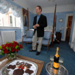 IT TAKES TWO: Win Baker, owner of the Abigail Stoneman Inn, in Newport, shows off a room with roses, chocolates and champagne prepared for a romantic getaway. / 