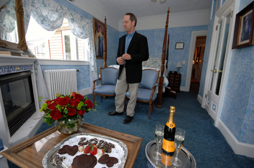 IT TAKES TWO: Win Baker, owner of the Abigail Stoneman Inn, in Newport, shows off a room with roses, chocolates and champagne prepared for a romantic getaway. / IT TAKES TWO: Win Baker, owner of the Abigail Stoneman Inn, in Newport, shows off a room with roses, chocolates and champagne prepared for a romantic getaway. /