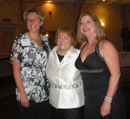 FROM LEFT: Rhode Island Mentoring Partnership Senior Vice President Jo-Ann Schofield, and President and CEO Arlene McNulty, center, celebrate with People’s Choice Award winner Deb Gormley, vice president and director of training at Citizens Bank. / FROM LEFT: Rhode Island Mentoring Partnership Senior Vice President Jo-Ann Schofield, and President and CEO Arlene McNulty, center, celebrate with People’s Choice Award winner Deb Gormley, vice president and director of training at Citizens Bank. /