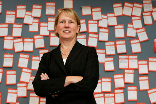 BRAND AWARENESS: Heidi Devlin, CVS Caremark VP of advertising, in front of her department’s “pad on the back” notice board. / BRAND AWARENESS: Heidi Devlin, CVS Caremark VP of advertising, in front of her department’s “pad on the back” notice board. /