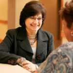 GOING HOME: Diana Franchitto, president and CEO of Home & Hospice Care of Rhode Island, left, talks with aide Delia DaCosta. / 