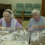 HOME COOKING: Rita Cronin, left, and Gertrude Soito make beef empanadas at St. Clare  Home. / 