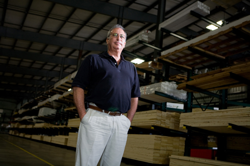 WOOD WORK: Mike Durand, owner of Coventry Lumber, stands in his facility, which has more than 10,000 products on 80,000 square feet of property. / WOOD WORK: Mike Durand, owner of Coventry Lumber, stands in his facility, which has more than 10,000 products on 80,000 square feet of property. /