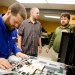 Skill development motivates workers at Envision CLEAR VISION: Envision employees, from left: Purchasing Engineer Joshua DeFreitas, Systems Engineer Jason Malloney, and CEO Todd Knapp. The company saw its first big success come with Y2K consulting and has not looked back. /