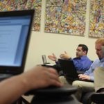 Promoting from within helps
keep employees motivated STRONG NETWORK: Atrion Corp. systems developer Josh Cliff, above with glasses, in a meeting at the company’s Warwick office. /