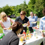 A family-friendly
firm that profits EMBRACING EACH OTHER: Embrace employees enjoy a BBQ following a company awards ceremony.
PBN PHOTO/
RUPERT WHITELEY /