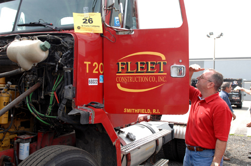 GOING ONCE: Gus Delfarno of Hayward Baker Constuction checks equipment at an auction of bankrupt Fleet Construction’s fleet of trucks. / GOING ONCE: Gus Delfarno of Hayward Baker Constuction checks equipment at an auction of bankrupt Fleet Construction’s fleet of trucks. /