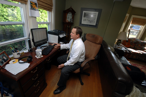 HOME WORK: Using technology to connect to the office from home allows lawyer Keith Kyle to both increase billable hours and live a more balanced life, though he has to set limits on his availability. / HOME WORK: Using technology to connect to the office from home allows lawyer Keith Kyle to both increase billable hours and live a more balanced life, though he has to set limits on his availability. /