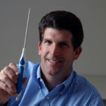 VESTED INTEREST: Jeffrey W. Morrill, CEO of NuOrtho Surgical Inc., with a 
device designed to clean up torn cartilage. / 