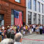 New Bedford Whaling Museum President James Russell addresses the crowd Saturday at a ribbon cutting ceremony celebrating the reopening of the Whaling Museum's 1906 entrance to its newly restored Old Dartmouth Historical Society - Wattles Family Gallery.  / 