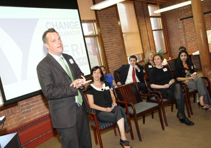 THE FIRST GRADUATING CLASS of Social Venture Partners Rhode Island Change Accelerator incubator program gathered Wednesday at the Rhode Island Center for Innovation and Entrepreneurship in Providence to celebrate the completion of their eight-week program. Speaking is Joe Vaughn, executive director of Groundworks Providence, a tree nursery that helps low-income communities plant trees.  / 