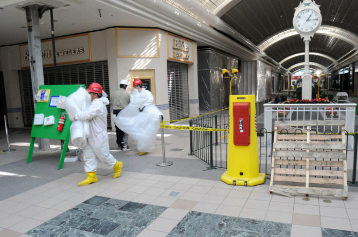 SOON AFTER THE MARCH FLOODS, workers were in the Warwick Mall, starting the cleanup and reconstruction of the shopping center. Target (seen at far end of hallway) is set to re-open Sunday, nearly three-and-a-half months after it closed due to the flooding of the Pawtuxet River. / SOON AFTER THE MARCH FLOODS, workers were in the Warwick Mall, starting the cleanup and reconstruction of the shopping center. Target (seen at far end of hallway) is set to re-open Sunday, nearly three-and-a-half months after it closed due to the flooding of the Pawtuxet River. /