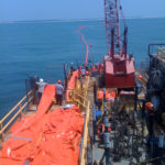 LINE OF DEFENSE: Louisiana-based American Pollution Control Corp. deploys oil booms off the Alabama coast to contain the oil well leak in the Gulf of Mexico. The material for the booms is made by the Cooley Group. / 