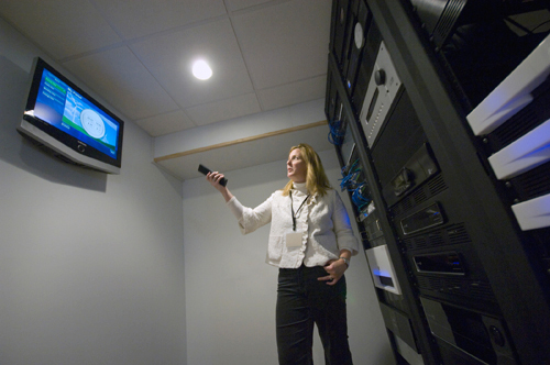 LEEDING THE WAY: Kimberly Lancaster Hageman checks the status of various systems in her home. / LEEDING THE WAY: Kimberly Lancaster Hageman checks the status of various systems in her home. /