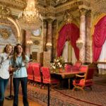 GUIDED TOUR: Two adults take the audio tour at The Breakers. The Preservation Society created the adult tour in 2009 and now has a matching program for kids. / 