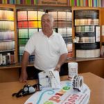 THE REMEDY: Parvo’s Paint & Flooring owner Bill Parvo displays various products he sells for lead-paint remediation. / 