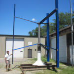 CLEAR CUT: Matt Dunham, owner of Clear Carbon & Components, in front of the company&rsquo;s Bristol location near the wind turbine he helped develop. / 