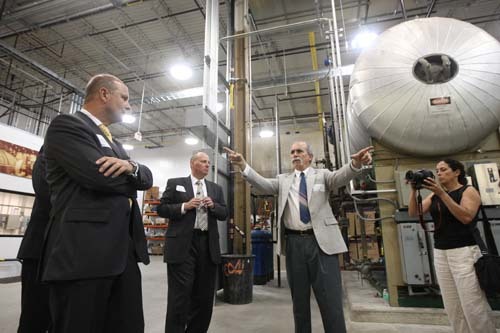 POWER SUMMIT: Achim Trasser, Tyco Flow Control vice president, left, and David Thibault, general manager of Tyco Flow Control of Mansfield facility, second from left, tour the Tyco Advanced Nuclear Testing & Development Facility. / POWER SUMMIT: Achim Trasser, Tyco Flow Control vice president, left, and David Thibault, general manager of Tyco Flow Control of Mansfield facility, second from left, tour the Tyco Advanced Nuclear Testing & Development Facility. /