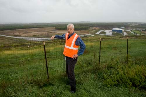 LAND LORDS: R.I. Resource Recovery Corporation Executive Director Michael OConnell, near 103 acres where the agency wants to expand the Central Landfill. A public hearing will be held by the Department of Environmental Management this week. / LAND LORDS: R.I. Resource Recovery Corporation Executive Director Michael OConnell, near 103 acres where the agency wants to expand the Central Landfill. A public hearing will be held by the Department of Environmental Management this week. /