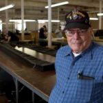 MAKING THE LEAP: C & E Industries Inc. owner Ceasar Braga opened the parachute-design and manufacturing shop with his wife, Elaine, in 2006. In 1950, he jumped out of an Army C-82 cargo plane. / 