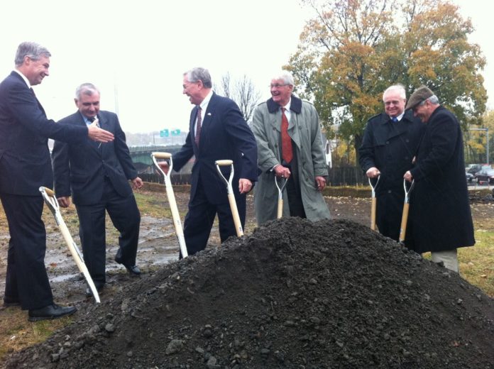 ELECTED OFFICIALS gathered on a closed off ramp Thursday to break ground on a new $106 million bridge carrying Interstate 95 over the Pawtucket River. / 