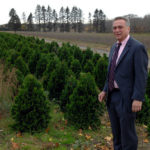 LOTS OF HOMES: Middletown Town Councilman Christopher Semonelli in front of an agricultural field off Oliphant Road. He doubts the town can handle the scope of new development suggested by a recent report. / 