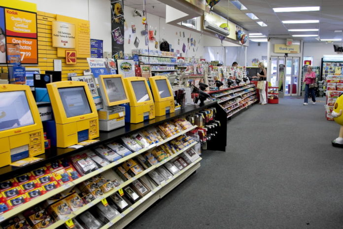 KODAK PHOTO PRINTING STATIONS STAND INSIDE A CVS/pharmacy store in Wyckoff, N.J. CVS reached an agreement with Connecticut for illegally dumping photo-processing chemicals into sewers. / KODAK PHOTO PRINTING STATIONS STAND INSIDE A CVS/pharmacy store in Wyckoff, N.J. CVS reached an agreement with Connecticut for illegally dumping photo-processing chemicals into sewers. /