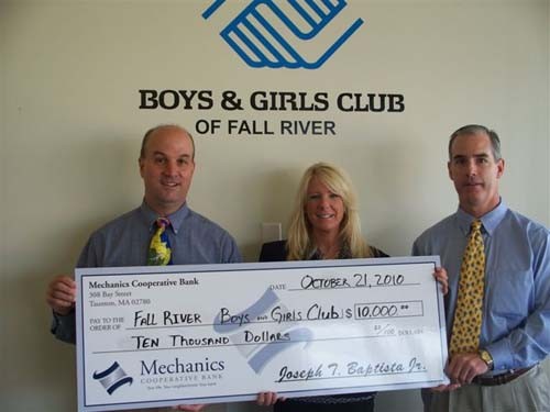 DEBORAH GRIMES, senior vice president and director of retail banking for Mechanics Cooperative Bank, presents a $10,000 donation to Peter McCarthy, left, executive director of the Boys and Girls Club of Fall River, and Bill Kiley, right, chief financial officer of the club. / DEBORAH GRIMES, senior vice president and director of retail banking for Mechanics Cooperative Bank, presents a $10,000 donation to Peter McCarthy, left, executive director of the Boys and Girls Club of Fall River, and Bill Kiley, right, chief financial officer of the club. /