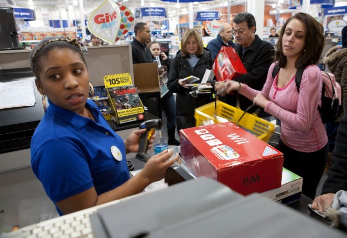 CHRISANTHI Kazantzis took advantage of Black Friday sales at Best Buy in Warwick. Despite the rain, a line of customers snaked along the front of the building at 5 a.m. - the time the store opened. / 