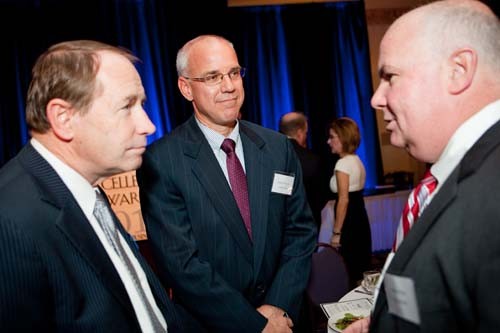 URI President David Dooley chats with executives from Citizens Bank. 