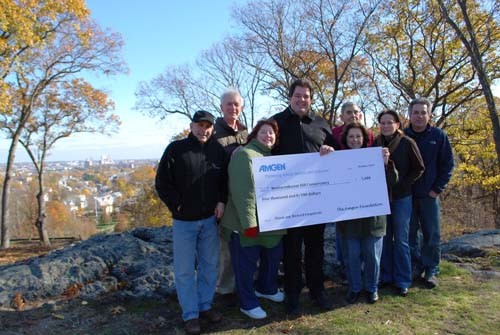 RICHARD FITZPATRICK, fourth from left, recipient of the 2010 Amgen Excellence in Volunteering Award, is joined by conservancy board members, from left: Richard Autiello, Doug Stephens, Susan Fitzpatrick, Elli Panichas, Anthony Panichas, Monica Rondeau and Anthony Ricci. / 