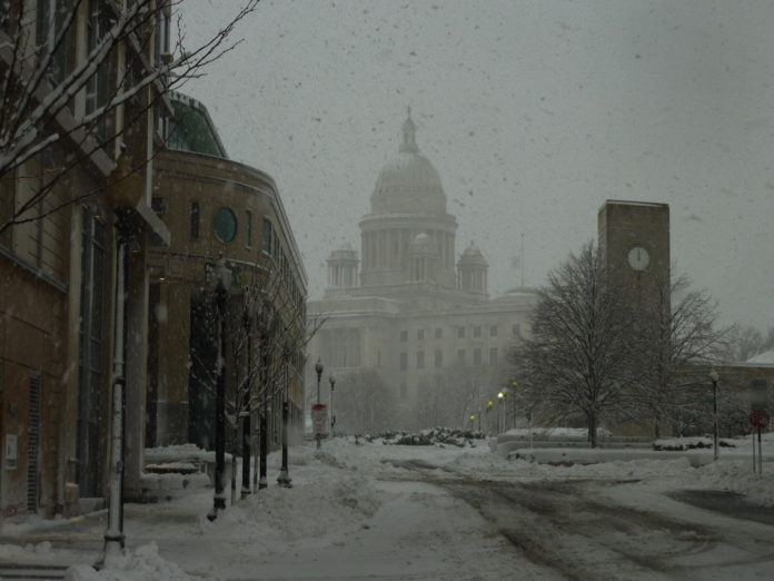 SNOW ACCUMULATIONS ARE ESTIMATED AT 19 TO 24 inches for Rhode Island, the National Weather Service said on Wednesday, as heavy snow obscured the Capitol in Providence. / 