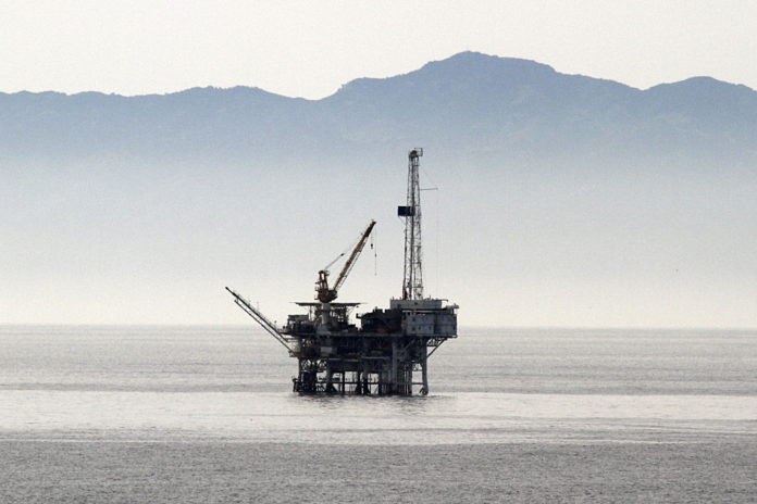 AN OIL rig stands offshore from Santa Barbara, Calif., on March 4. / AN OIL rig stands offshore from Santa Barbara, Calif., on March 4. /
