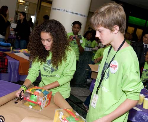 GIVING BACK: Students involved with GenerationON in Washington, D.C., wrap gifts donated by Hasbro to be given to
children at homeless shelters. / GIVING BACK: Students involved with GenerationON in Washington, D.C., wrap gifts donated by Hasbro to be given to
children at homeless shelters. /