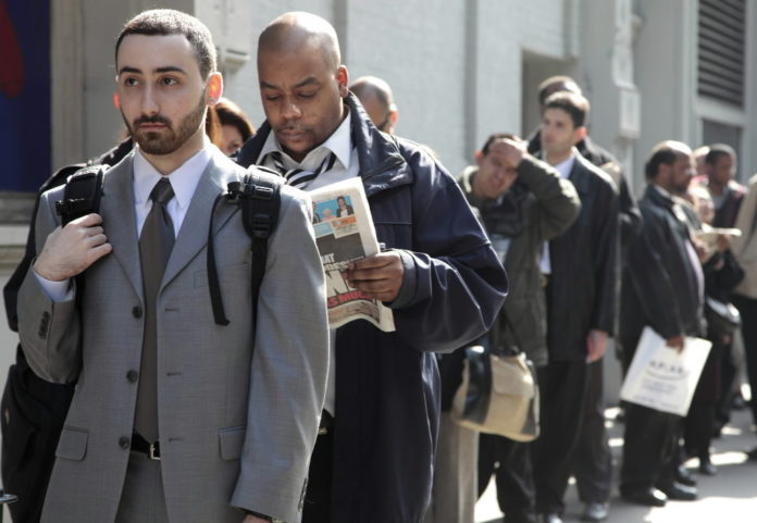 FILE PHOTO: JOB SEEKERS line up outside a career fair. Rhode Island's jobless rate fell in March to 11 percent. / 