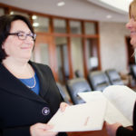Her immersion in job helps BancorpRI profit BANKING ON IT: Linda Simmons, left, chief financial officer at Bancorp Rhode Island, joined the institution in 2004. She helped the then-fledgling company grow and expand its presence in the state. /