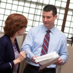The man behind finance plan at Narragansett Bay BAY WATCH: Sean F. Murphy, chief financial officer at Narragansett Bay Insurance Co., speaks with senior accountant Donna Rizardini. He leads compliance efforts for state regulations in Rhode Island, Massachusetts, New Jersey and New York. /