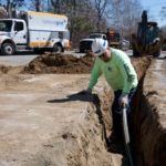 NATIONAL GRID employee installs gas lines. The utility company is the largest in Rhode Island. / PBN FILE PHOTO