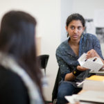 SHIPPING COSTS: Karuna Hanisharker, a RISD student, discusses potential uses for shipping containers. The university is offering a course that promotes new ways to stack the containers to develop sustainable buildings. / 