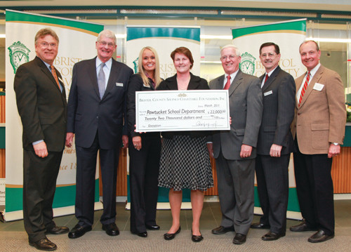 DEBORAH CYLKE, center, Pawtucket schools superintendent, receives a $22,000 check from representatives of Bristol County Savings Bank and Bristol County Savings Charitable Foundation – Pawtucket Advisory Board: Remaining, from left, Patrick Murray, president, Bristol County Savings Charitable Foundation and executive vice president/treasurer and chief operating officer, Bristol County Savings Bank; James Doyle, Bristol County Savings Charitable Foundation board member and vice president, business-development officer, Bristol County Savings Bank; Michele Roberts, clerk, Bristol County Savings Charitable Foundation, and senior vice president, Bristol County Savings Bank; Dennis Kelly, chairman, Bristol County Savings Charitable Foundation, and president, Bristol County Saving Bank; Ken Riley, Bristol County Savings Charitable Foundation board member and assistant vice president, Bristol County Savings Bank; and Mike Tamburro, Bristol County Savings Charitable Foundation board member and president of the Pawtucket Red Sox. / DEBORAH CYLKE, center, Pawtucket schools superintendent, receives a $22,000 check from representatives of Bristol County Savings Bank and Bristol County Savings Charitable Foundation – Pawtucket Advisory Board: Remaining, from left, Patrick Murray, president, Bristol County Savings Charitable Foundation and executive vice president/treasurer and chief operating officer, Bristol County Savings Bank; James Doyle, Bristol County Savings Charitable Foundation board member and vice president, business-development officer, Bristol County Savings Bank; Michele Roberts, clerk, Bristol County Savings Charitable Foundation, and senior vice president, Bristol County Savings Bank; Dennis Kelly, chairman, Bristol County Savings Charitable Foundation, and president, Bristol County Saving Bank; Ken Riley, Bristol County Savings Charitable Foundation board member and assistant vice president, Bristol County Savings Bank; and Mike Tamburro, Bristol County Savings Charitable Foundation board member and president of the Pawtucket Red Sox. /