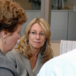 INSURANCE POLICY: Theresa Molloy, above in glasses, sees herself as a role model for women looking to enter the male-dominated insurance industry. / 