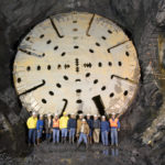 Health of bay, workers gets priority MEMBERS OF THE Narragansett Bay Commission and others pose with a boring machine at the Combined Sewer Overflow tunnel in Providence. / PBN FILE PHOTO