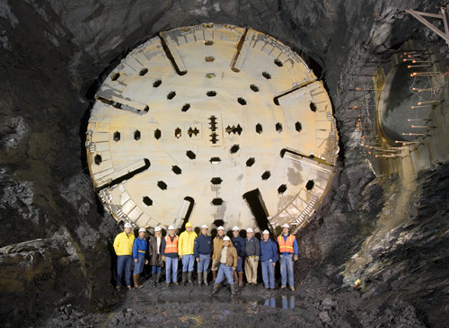 MEMBERS OF THE Narragansett Bay Commission and others pose with a boring machine at the Combined Sewer Overflow tunnel in Providence. / PBN FILE PHOTO MEMBERS OF THE Narragansett Bay Commission and others pose with a boring machine at the Combined Sewer Overflow tunnel in Providence. / PBN FILE PHOTO