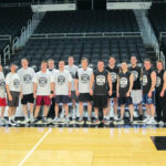 TIP OFF: Competing against larger, more established firms for clients requires an energetic staff, illustrated by firm basketball games. / 